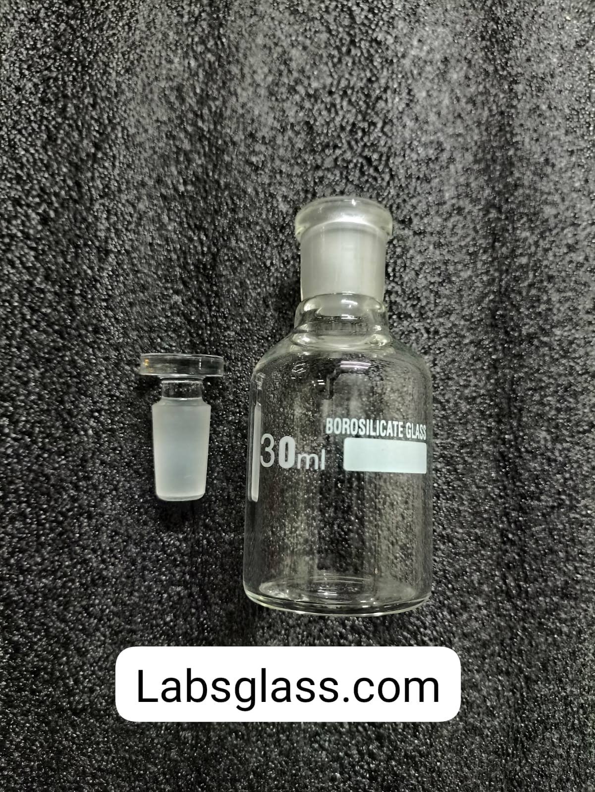 Reagent Bottle 'SGCLABS' N.M. with I/C Stpr 25/30 ml. 1 Reagent Bottles, "SGCLABS", Narrow Mouth, with interchangeable Stopper.